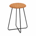Tabouret en métal noir avec tissu floral orange